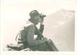 Expedition member Robert A. Brown looking for goats, The University of Iowa, 1920