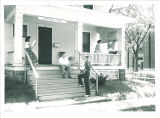 Students on front porch of the International Center, The University of Iowa, June 1954
