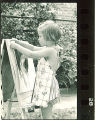 Girl with painting at preschool, The University of Iowa, 1920s
