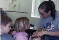 Students make pine cone bird feeders