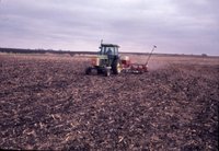 Tractor plowing field, 1981
