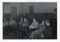 Seven Unidentified  Men Meet Around Table
