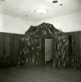 An exit decorated liked a train tunnel for the Homecoming Dance, 1965