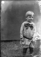 UP411 Small boy with toy horse