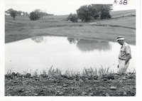 Engineer Harold Shold inspecting erosion control dam, 1967