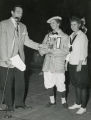 Winners of the Homecoming Bike Race receiving a trophy from Joe Adams, 1953