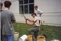 1999 Trimming the roots of a new tree before planting it