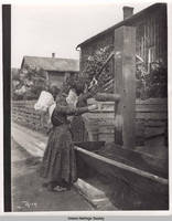 Two children at a pump