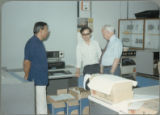 Earl O. Heady hearing about upgraded equipment at the Office of Agricultural Economics computer center in Bangkok, Thailand, 1983.