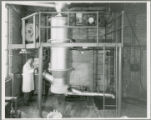 Professor David R.  Boylan  working with shaft furnace