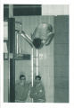 Diver at high school swim meet, The University of Iowa, March 1967