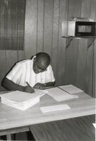 Terry Cosby, district conservationist, works at his desk