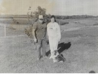 Family poses on their farmland.