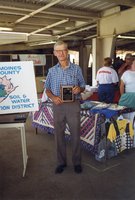 1998  Harold Linder stands holding a plaque as the winner of the first Gary Wagner Memorial Stewardship Award