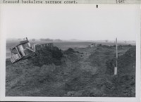Grassed backslope terrace construction.