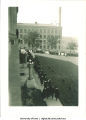 Commencement procession passing by Old Capitol west portico, with Engineering Building in background, The University of Iowa, 1920s