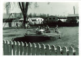 Children on playground of a married housing unit, the University of Iowa, April 18, 1958