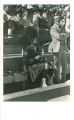 Scottish Highlander sitting on bleachers, The University of Iowa, 1970s