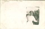 Girl standing with pine tree, McLoud, Oklahoma, December 23, 1912