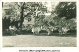 Women dancing on the Pentacrest in front of a large audience at a June celebration, The University of Iowa, 1920