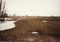 Melting snow on Construction site where pond is being built on Frank Johnson's farm
