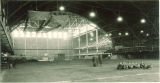 Students sitting on a playing field in the Field House, the University of Iowa, 1930s?