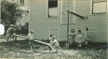 Children on playground equipment, The University of Iowa, ca. 1920