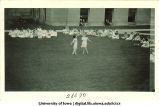 Women in costume dancing on the Pentacrest lawn, The University of Iowa, June 1924