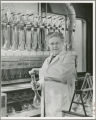 Pearl Swanson in a laboratory with test tubes, 1947