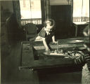 Girl playing with toy boat, The University of Iowa, February 22, 1938