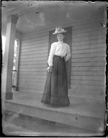 UP573 Woman standing on porch