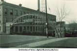 Homecoming arch on Washington St. next to Engineering Building, The University of Iowa, 1920s