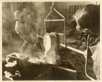 Art students pouring metal into a cast, The University of Iowa, 1970