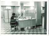 Librarian assists patron in the Main Library, the University of Iowa, 1955