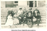 Class of 1876 alumni posed on Old Capitol steps, The University of Iowa, 1910s