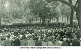 Commencement on the Pentacrest with Clinton Street business district in background, The University of Iowa, June 1925