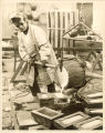 Art student pouring metal for a casting, The University of Iowa, 1970