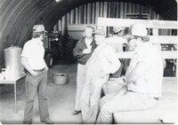Six men in barn