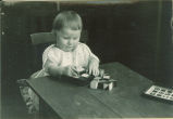 Toddler playing with blocks, The University of Iowa, 1920s