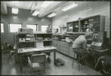 Seated researcher in laboratory, 1973