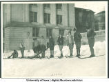 Student skiers on campus hill, The University of Iowa, 1920s
