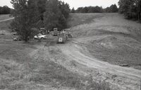 1970's Grassy field with machinery