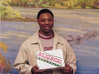 Staff holding doughnuts