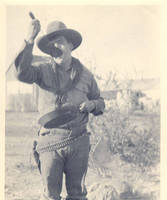 Unknown man eating from skillet with a large ladle