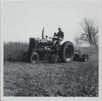 Bobby Spurgeon cutting brush on his farm.
