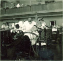 Dentist examining patient, The University of Iowa, 1940s