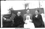 Four generations, Mrs. Samuel Calvin, mother, daughter and grandchild, The University of Iowa, 1900s