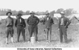 Men standing near tents at Camp Macbride, The University of Iowa, 1914