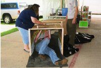 2010  Fair Booth Display table being set up by Caleb Waters, Mark Delperdang, and Jamie Grimes