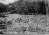 Flood waters carried boulders to where wash of hill emerges on small plain, Dorchester, Iowa, late 1890s or early 1900s